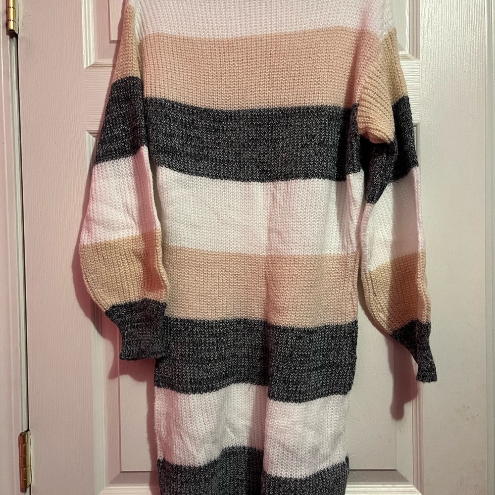 Soft delicate sweater, dress or pair with slacks or jeans. Stylish fancy.
